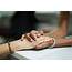 Best Two Women Holding Hands Stock Photos Pictures & Royalty Free 