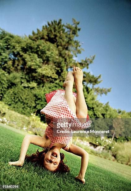 Girl In Dress Doing Handstand Bildbanksfoton Och Bilder Getty Images