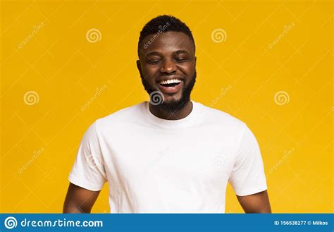 Smiley African American Guy In White T Shirt Studio Portrait Stock