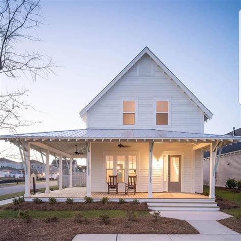 Barndominium on Instagram: “Love the wrap-around porch, perfect for