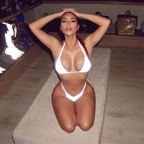 Kim Kardashian Puts Her Curves On Full Display In Two Piece Reflective