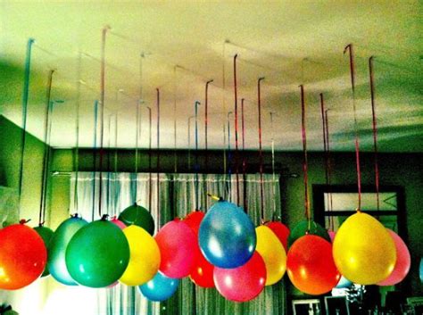You can hang paper fans, tissue flower balls, paper lanterns, and other birthday decorations from the ceiling. Balloons Hanging from the Ceiling | VBS 2014 ideas ...