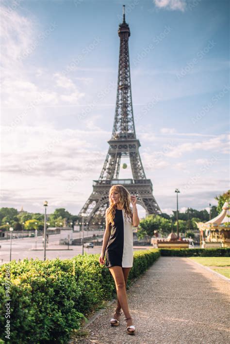 Beautiful Girl In Paris On A Background Of The Eiffel Tower Stock Photo