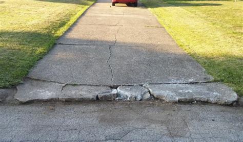 Lower than your garage floor, it's time to fix it. Driveway repair by street - DoItYourself.com Community Forums