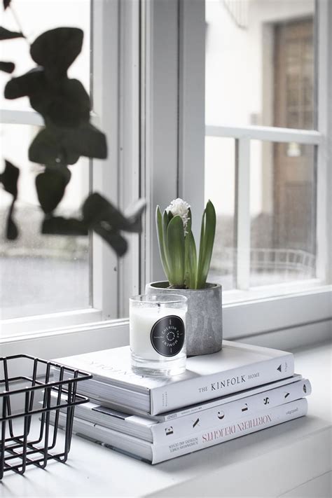 cement + books + candle + plants + window | modern simple decor