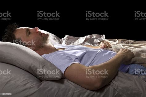 Close Up Of Insomniac Unable To Sleep In Bed Stock Photo Download