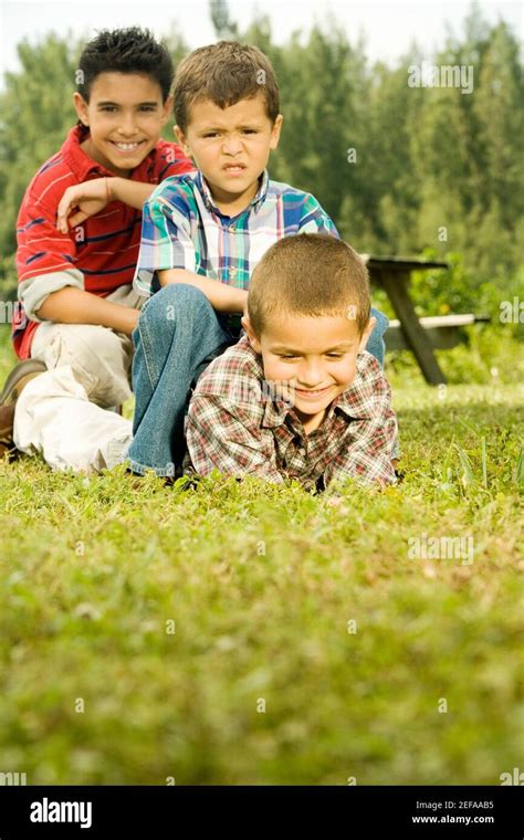 Three Boys In The Garden Stock Photo Alamy