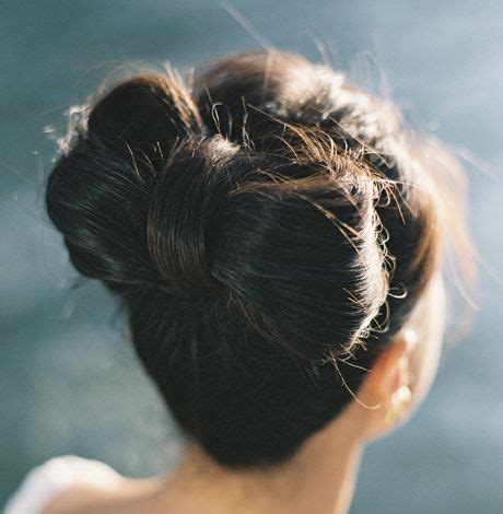Pull half ponytail through opening and wrap hair up and twist around pony base. brunette-hair-in-bow-shaped-bun-bridal-hairdo ...