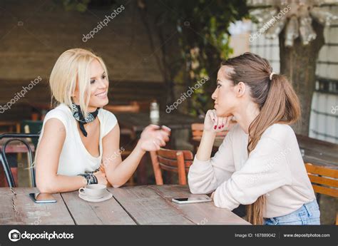 Two women talking in cafe bar — Stock Photo © rilueda #167889042