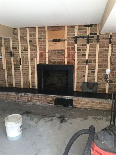 The fireplace was completed on friday and kevin finished i think it looks great and absolutely transforms your room. DIY Brick Fireplace Transformation | Brick fireplace ...