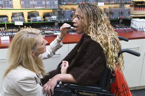 Carer And Young Woman With Cerebral Palsy Shopping Stock Image C0467358 Science Photo Library