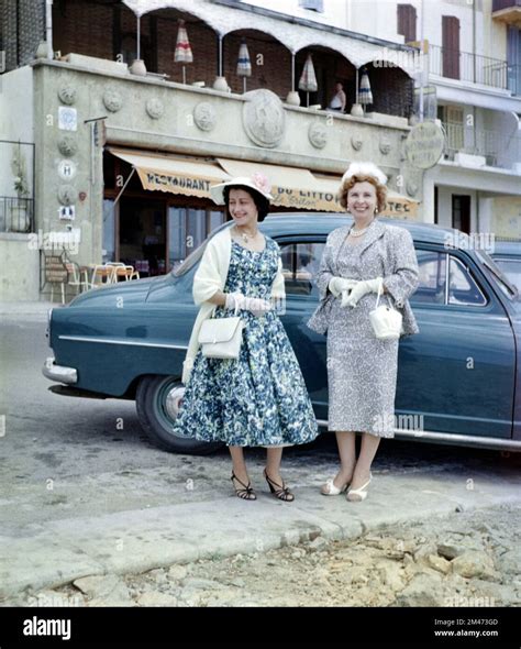 1950s french women dressed in 1950s fashion or clothes outside restaurant on the côte d azur or