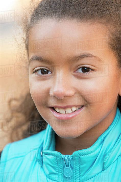 Close Up Of Smiling Mixed Race Girl Stock Photo Dissolve