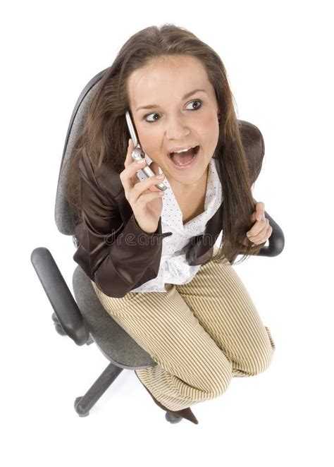 Woman Sitting On The Office Chair Talking To The Mobile Phone Stock