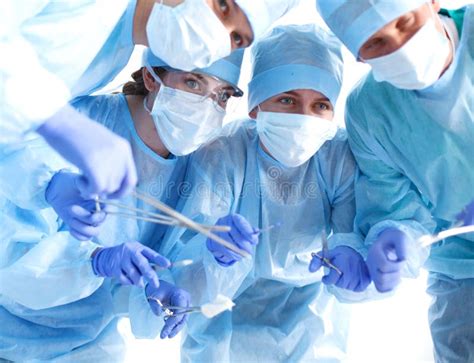 Team Surgeon At Work In Operating Room Stock Image Image Of Group