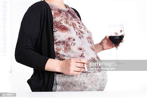 pregnant woman smoking and drinking photos and premium high res pictures getty images