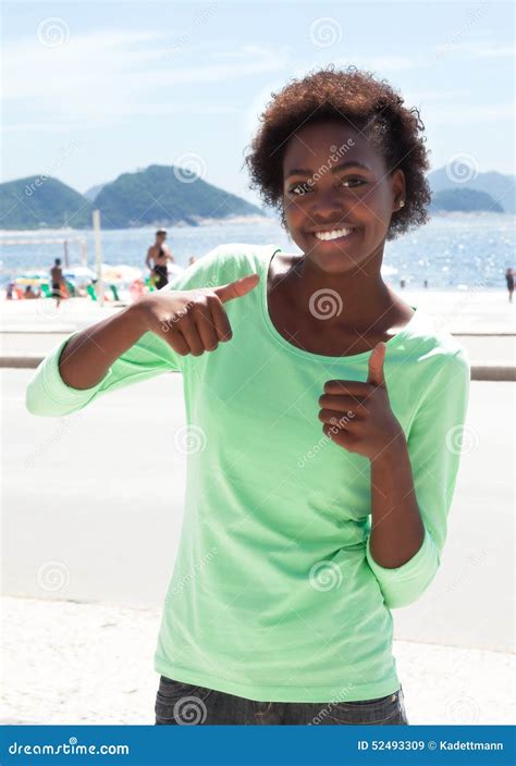 Brazilian Woman At Copacabana Beach Showing Thumbs Stock Photo Image