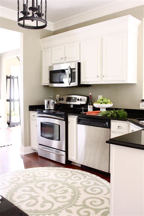 Why this kitchen wasn't originally built with a true island is beyond me. White Kitchen Cabinets With Crown Molding | HGTV