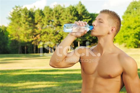 Handsome Man Drinking Water From Plastic Bottle Stock Photo Royalty