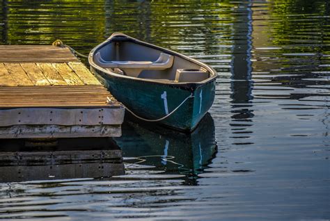 Docked Rowboat On Lake Free Stock Photo - Public Domain Pictures