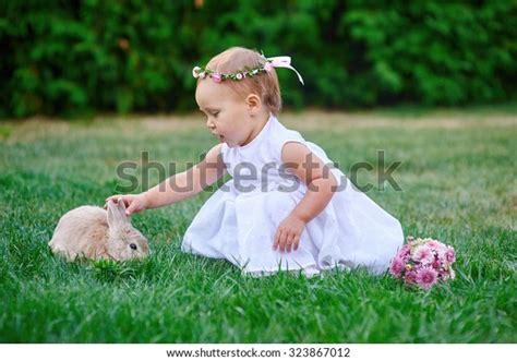 Little Girl Playing Rabbit On Grass Stock Photo 323867012 Shutterstock