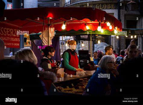 A Market Trader At A Stall In Borough Market Bermondsey One Of London