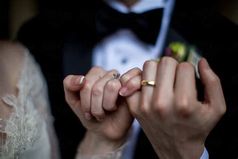 Wedding Couple Holding Hands Showing Off Rings By Leah Flores