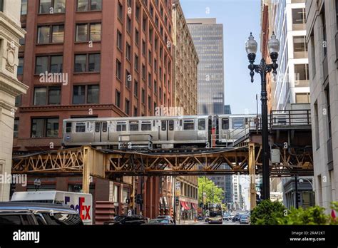 Chicago L Elevated Blue Line Train Passing Over A Chicago Street