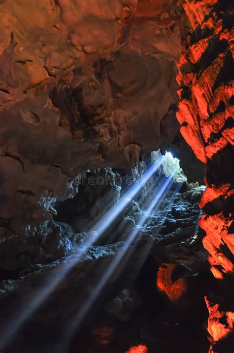 Colorful Sun Light Rays Shining Into Cave In Halong Bay World Heritage