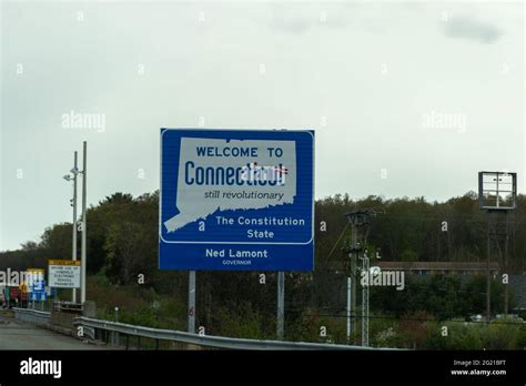 Welcome To Connecticut Sign On A Gray Cloudy Day With Road Construction