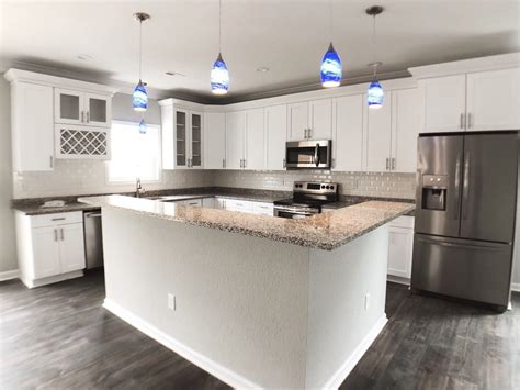 With only 24 hours left until the hardwood floor guys were showing up to install our new floors, we rented a cement grinder to get rid of the adhesive on the floor. Kitchen Inspiration. New design. White cabinets look great with LVP flooring. | Kitchen, Wine ...