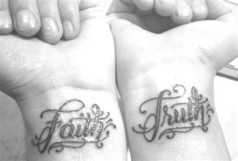 Some wrist tattoos span both wrists. i like the writing | Wrist tattoos, Tattoo designs, Tattoos