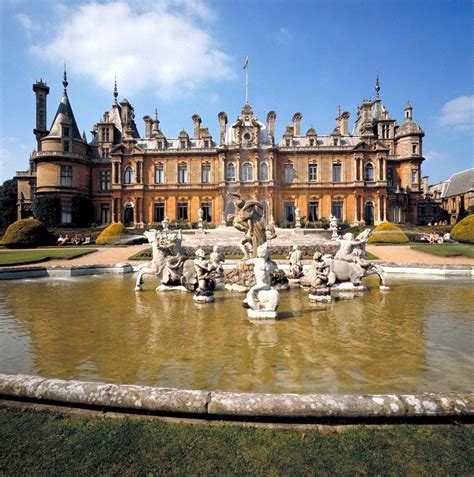 A Large Building With A Fountain In Front Of It