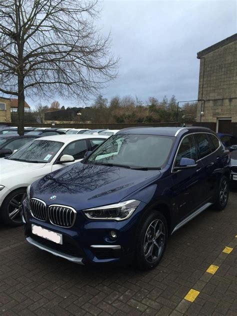 Extended lighting with logo projection. Official F48 X1 Mediterranean Blue Metallic Photo Thread - Bimmerfest - BMW Forums