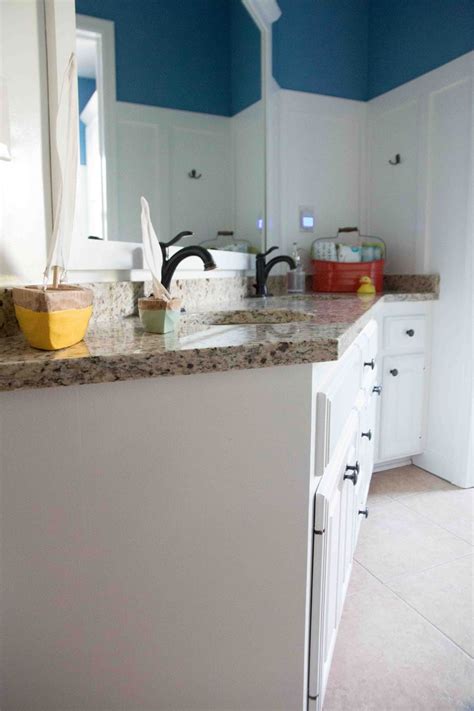 The tiles are a light neutral color. How to Paint Bathroom Cabinets: Why You Shouldn't Sand ...