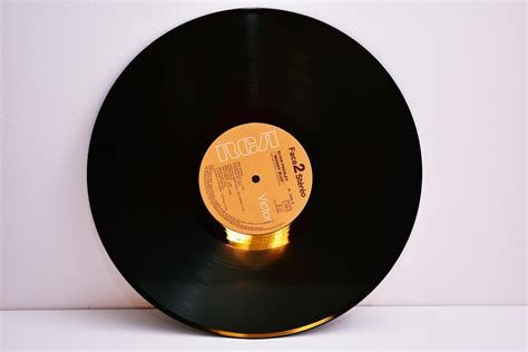 Yellow And Black Vinyl Disc · Free Stock Photo