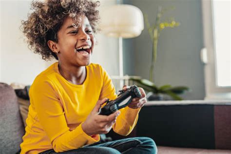 Kids Playing Video Games Stock Photos Pictures And Royalty Free Images