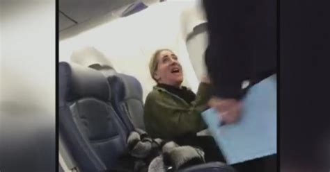 woman seen berating flight attendant on viral video now placed on leave cbs news