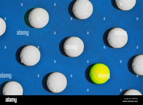 Creative Composition Made With Yellow Tennis Ball And White Balls On