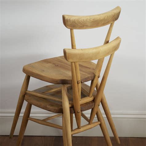 Stacking chairs made of either plastic or fiberglass are durable and lightweight, perfect for the patio. Ercol adult height stacking chairs (392)- 1950's. (2 ...
