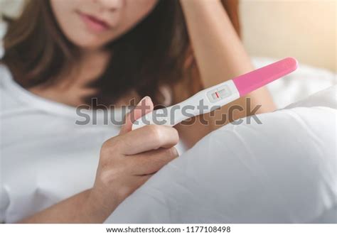 Unhappy Young Asian Woman Holding Pregnancy Stock Photo Edit Now