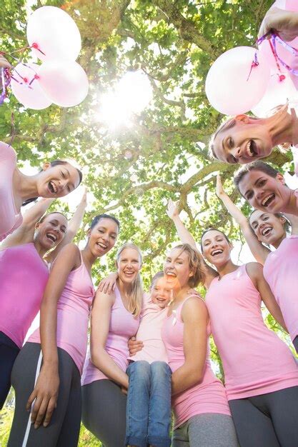 Premium Photo Smiling Women In Pink For Breast Cancer Awareness
