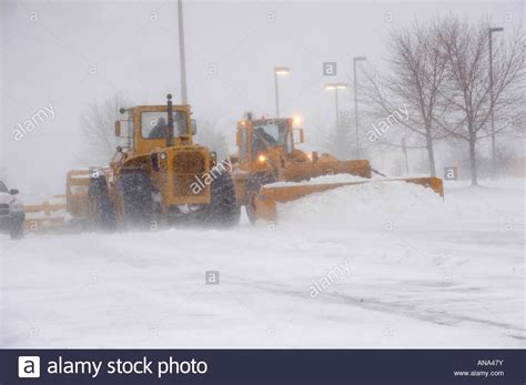 Snow Plow Busy Clearing Streets And Roads During Winter Season In The