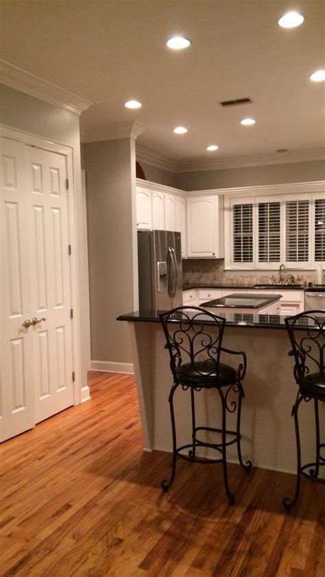 Another issue to consider is if you have too many coats on the wall the weight of all the coats of paint can cause stress and pull everything off. Fresh coat of paint for the cabinets and walls. Cabinets ...
