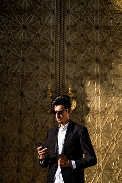 Moroccan Man With Sunglasses And Suit Next To Royal Palace In Fe Photograph By Cavan Images Pixels