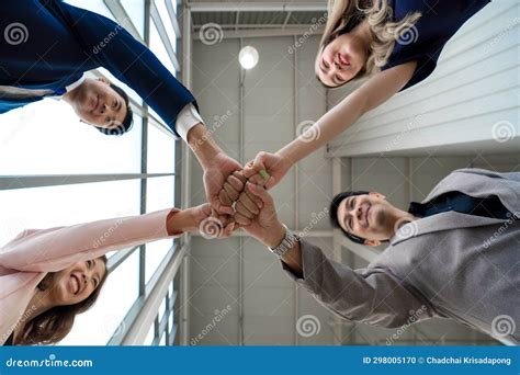 Team Building Concept Coworker Standing In Circle Bumping Fist