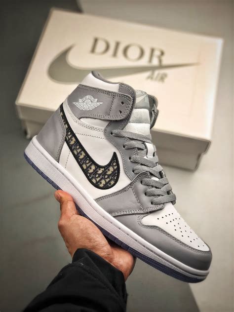 The air dior (official name: The Dior x Air Jordan 1 High Sneaker White and Grey Upper ...