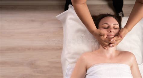 Pampering And Massage For Face Young Woman In Spa Salon Masseur Doing