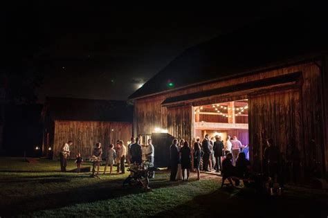 Guests Enjoy The Crisp Night Air At A Fall Wedding With Twinkle Lights