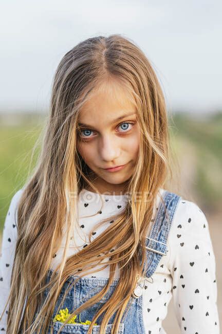 Blond Girl With Blue Eyes Standing At Field 10 11 Years Long Hair